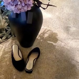 Black slingback suede shoe.